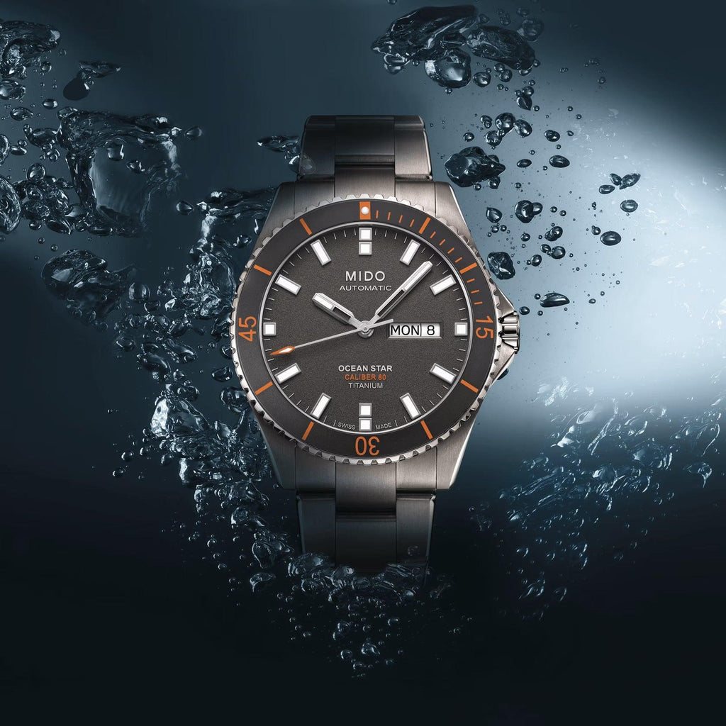 Orologio automatico Mido Ocean Star con bracciale grigio e lunetta arancione