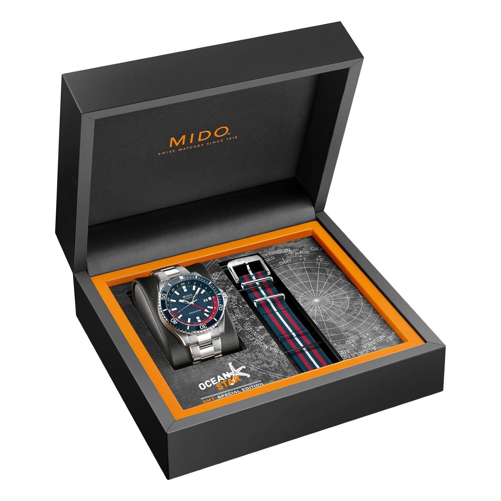 Scatola con due orologi MIDO Ocean Star GMT, quadranti blu e cinturino a righe