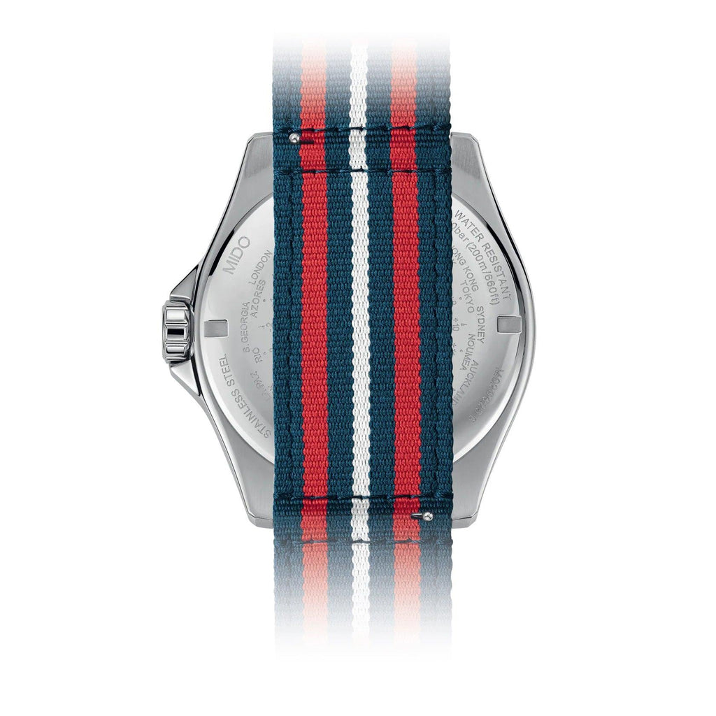Orologio MIDO Ocean Star GMT sul retro, cinghia a righe blu e rosse