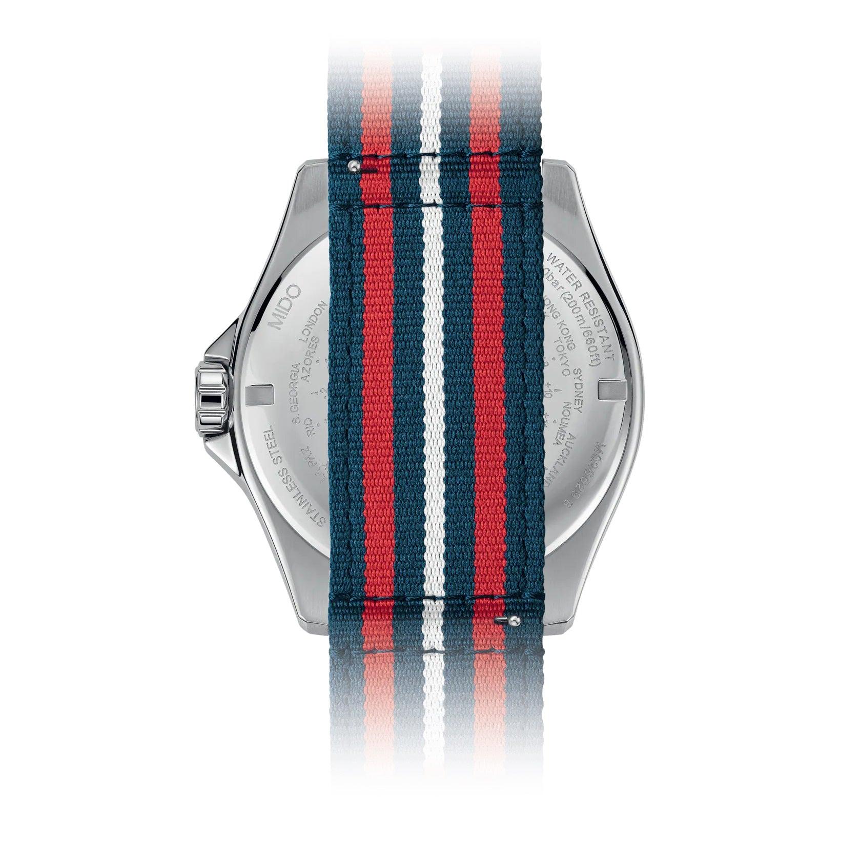 Orologio MIDO Ocean Star GMT sul retro, cinghia a righe blu e rosse