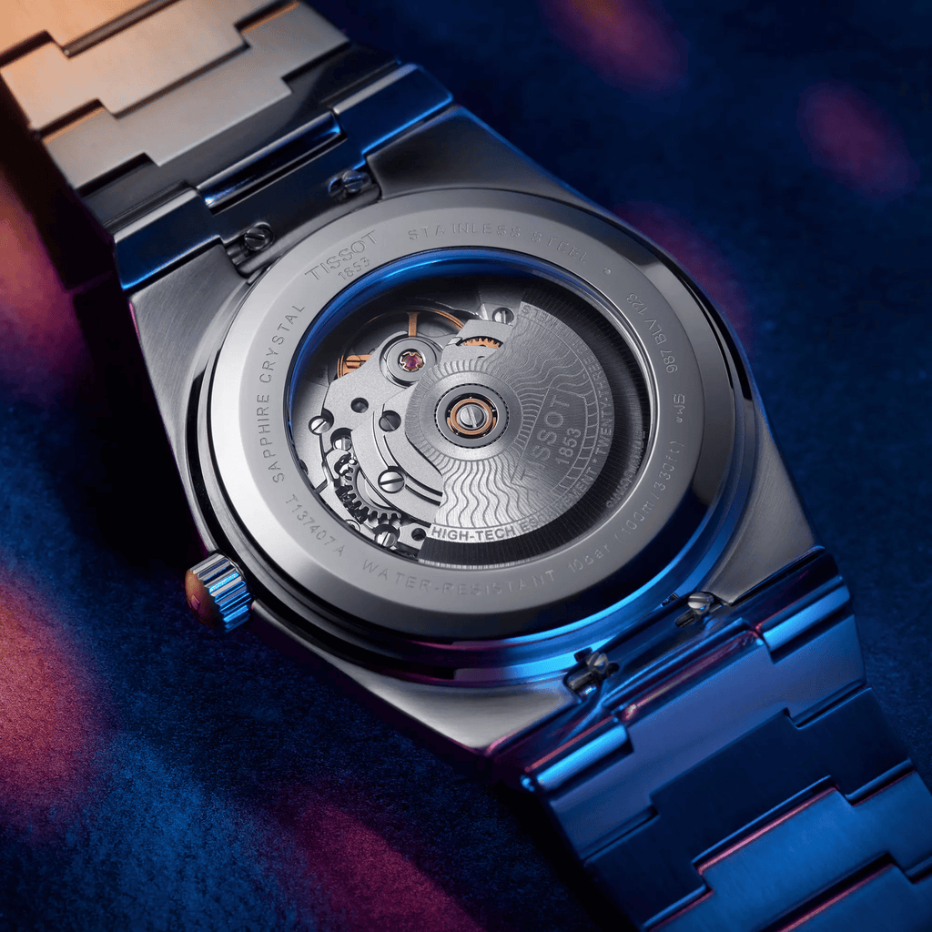 Orologio Tissot PRX, fondello a vista con movimento, cassa e bracciale in acciaio