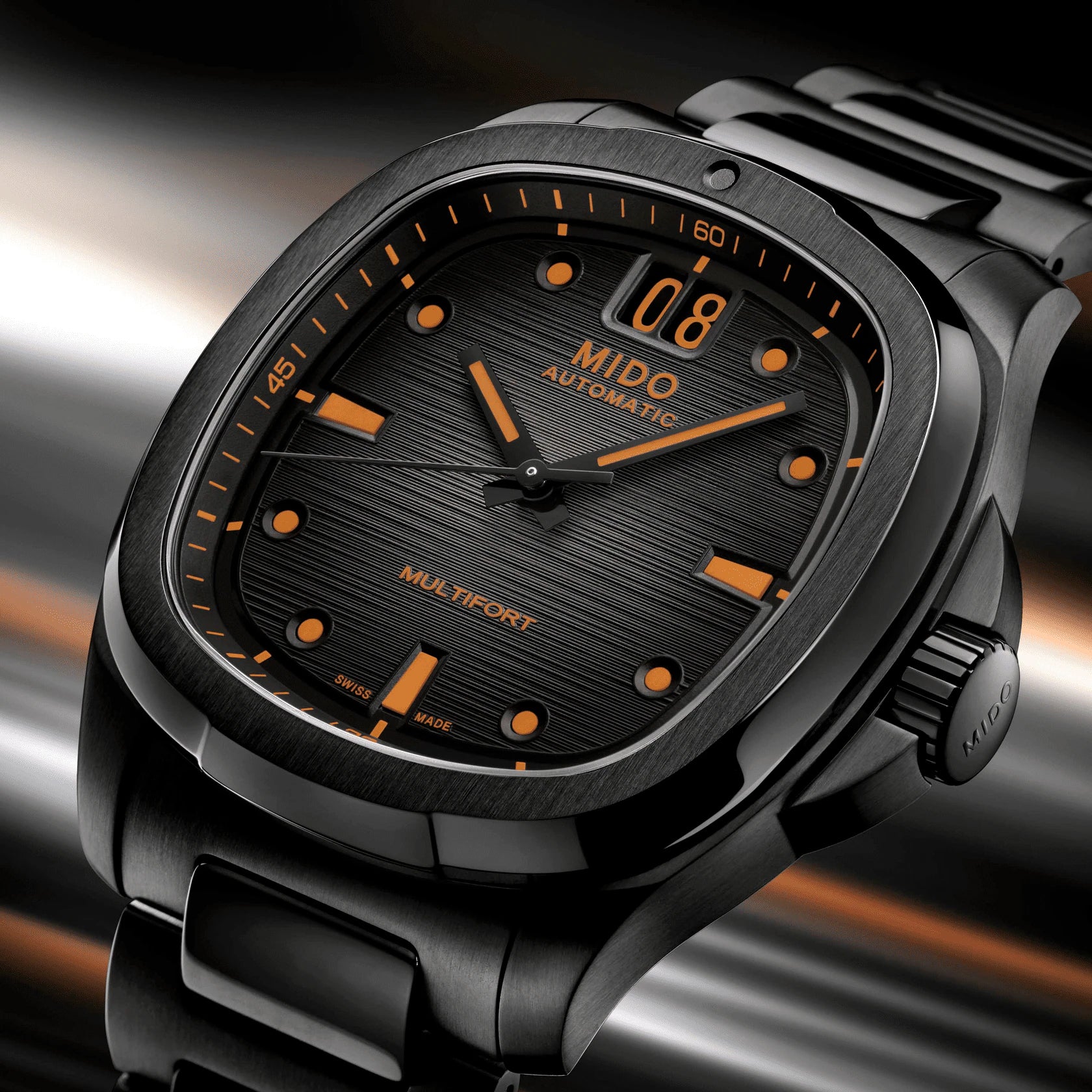 Orologio Mido automatico con quadrante nero a texture e indici arancioni, Big Date