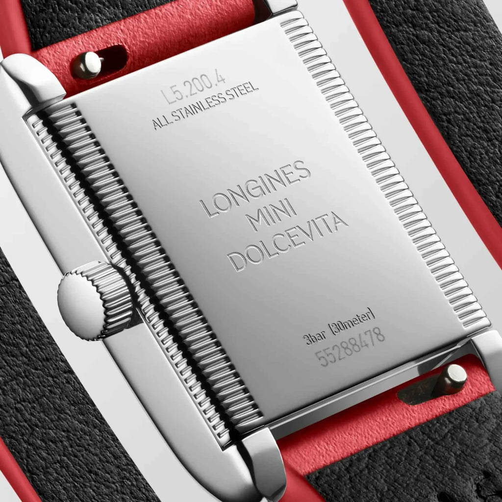 Fondello dell’orologio Longines in acciaio con incisioni e cinturino in pelle rossa