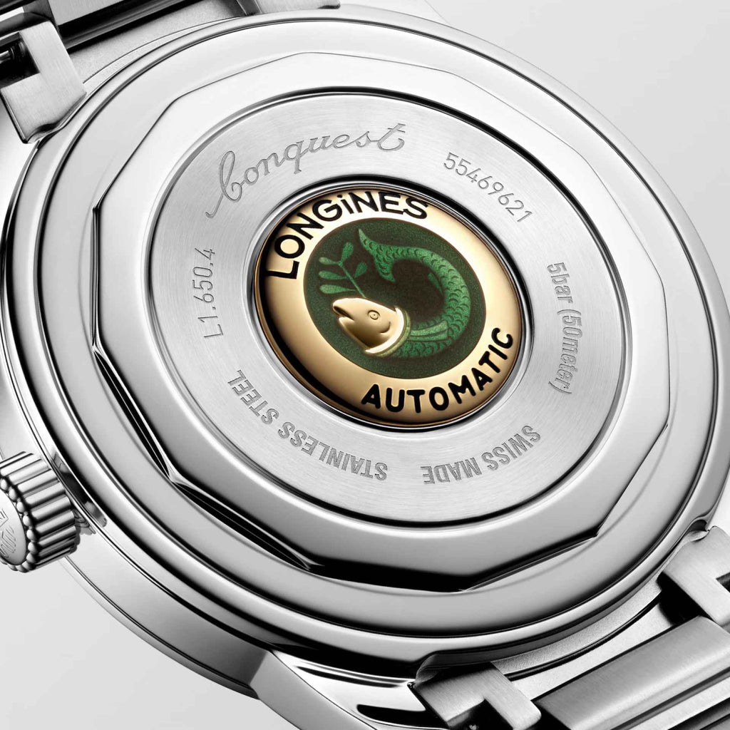 Fondello dell’orologio Longines automatico con rotore e scritte su vetro.