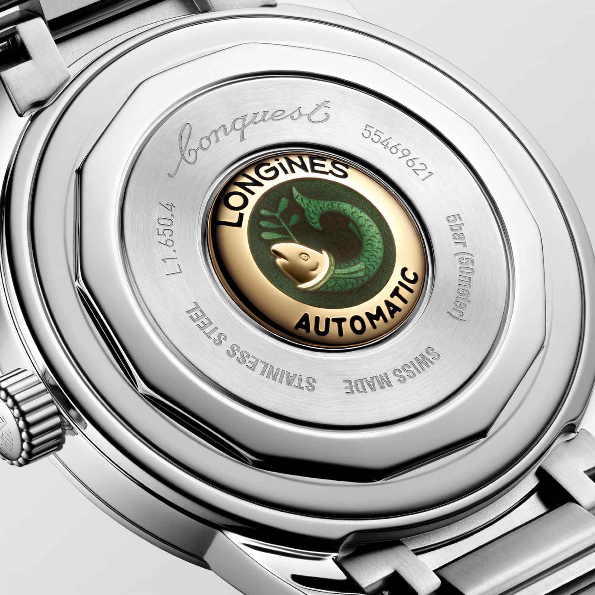 Fondello dell’orologio Longines automatico con rotore e scritte su vetro.