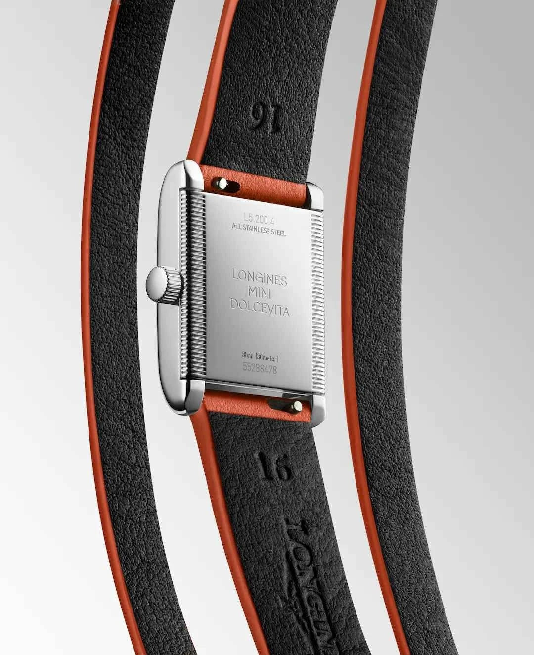 Orologio Longines Mini Dolcevita con cinturino nero e rifiniture arancioni, cassa argento.