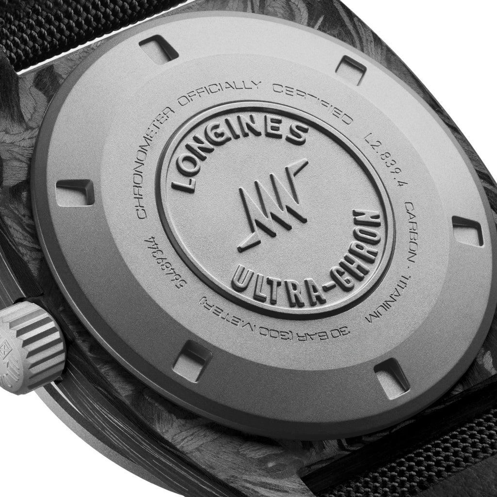 Fondello dell’orologio Longines Ultra-Chron, cassa metallica con incisioni e dettagli