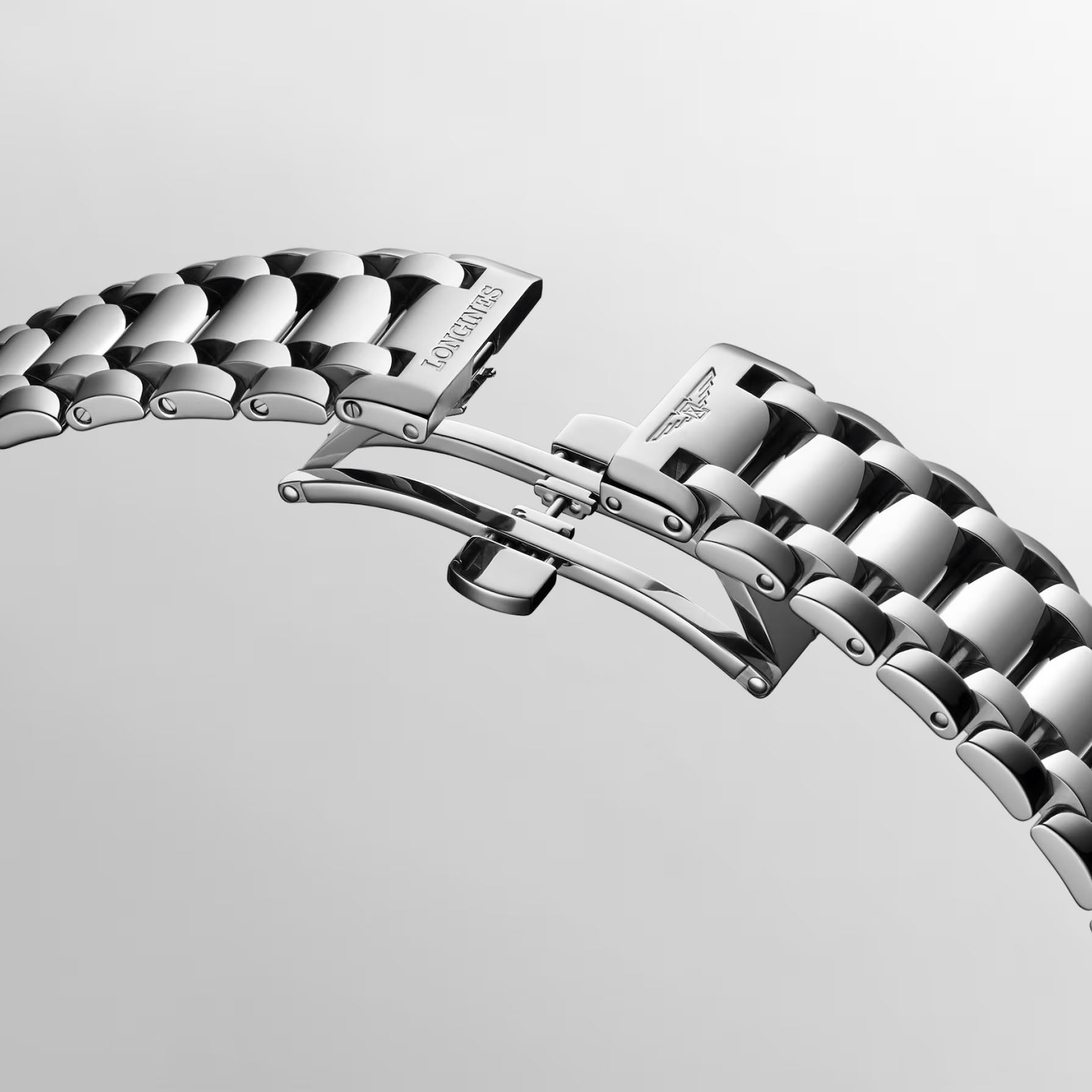 Orologio Longines con bracciale in acciaio lucido e cinturino con fibbia laterale