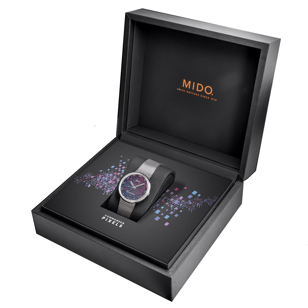 Orologio Mido nella confezione aperta, quadrante viola e bracciale in maglia d’acciaio